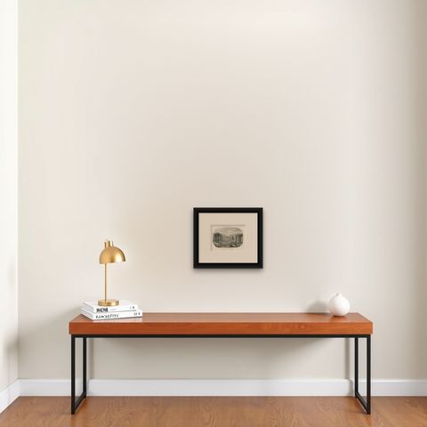 Small Antique Print of Ruins of Ancient Columns on Tinian Island, shown framed on a wall, true to size